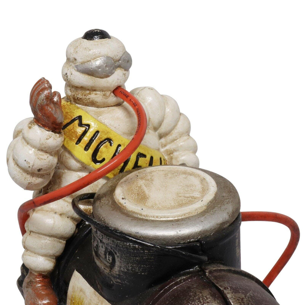 Cast Iron Michelin Man Sat On Compressor Ornament